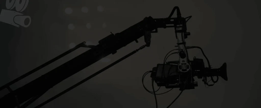 Camera crane against a dark sky